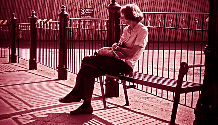 Senior woman alone on a bench